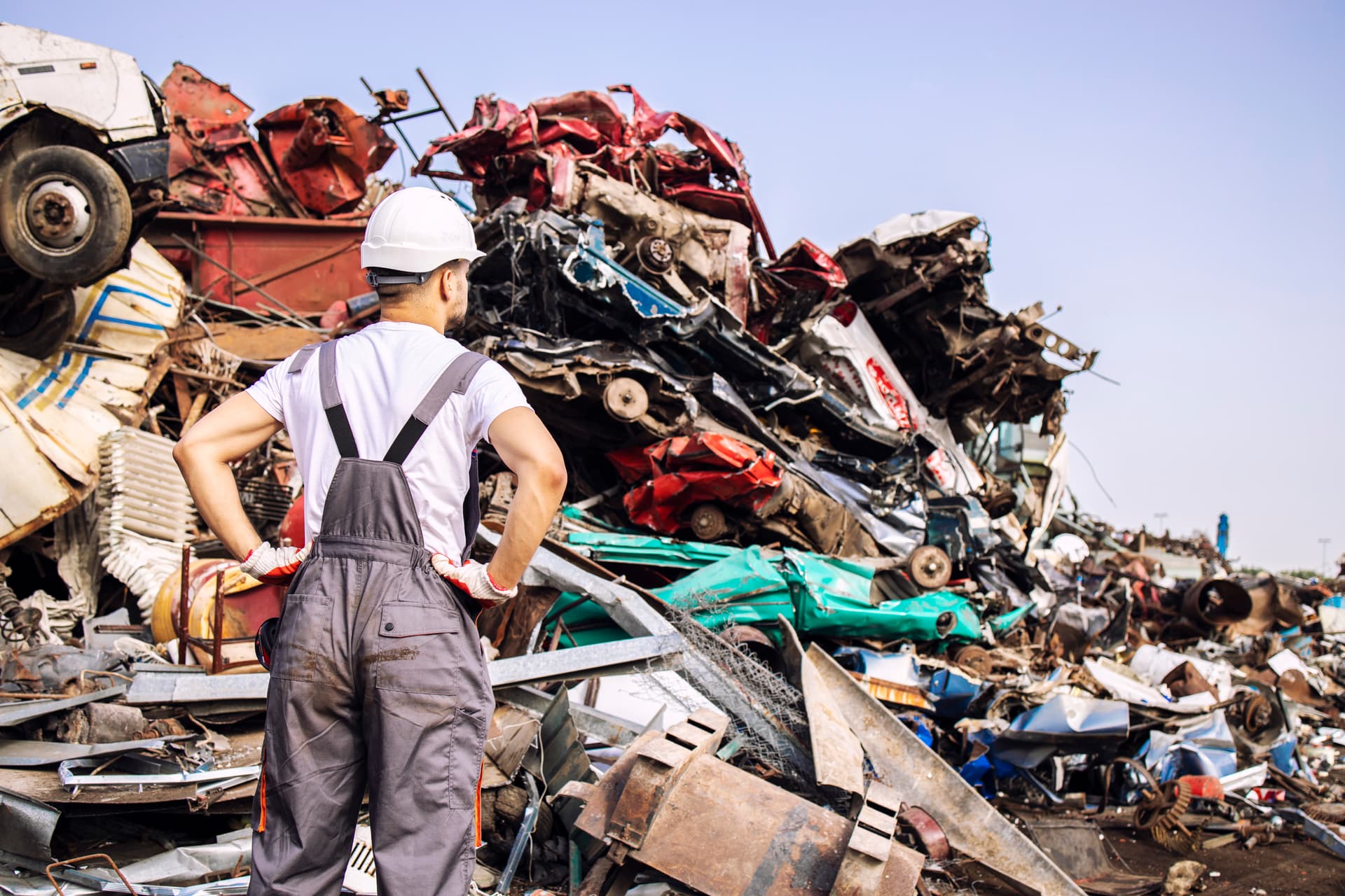Recycling worker inspecting scrap materials